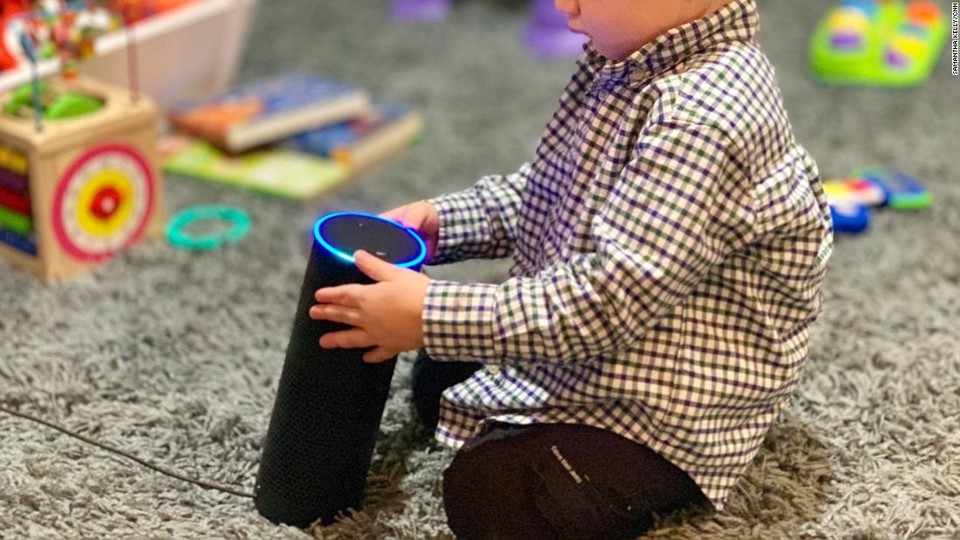 A child interacts with smart speaker