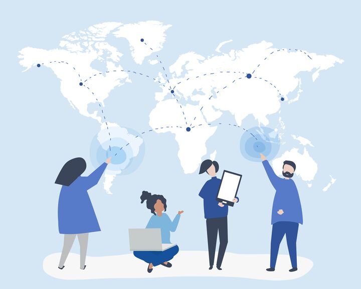 People using technology with a world map in the background